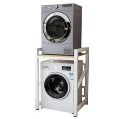 a washer and dryer stacked on top of each other in front of a white background