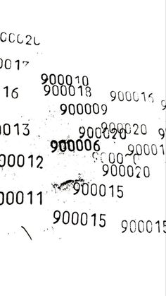 the numbers are written in black and white on a piece of paper that has been altered