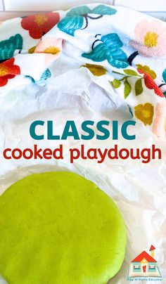 a close up of a pizza on a paper towel with the words classic cooked playdough