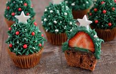 cupcakes decorated with christmas trees and strawberries