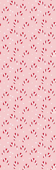 a pink background with red and white candy canes