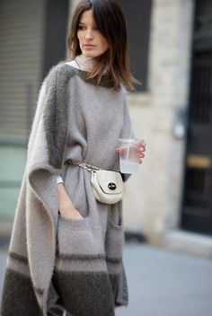 This oversized dove charcoal wool sweater cape is to die for and the paired cream fanny pack with it tops it off Walking Down The Street, Blanket Coat, Knitted Coat, Knitted Poncho, Cozy Outfit, Sweater Coats, Look Fashion