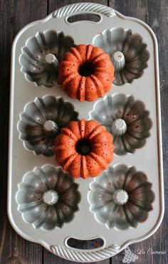 three bundt cakes sitting in a muffin pan