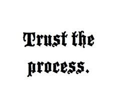 the words trust the process written in black ink