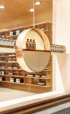 the inside of a store with shelves filled with bottles