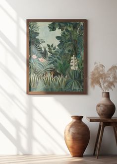 two vases sitting next to each other in front of a painting on the wall