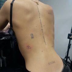 the back of a woman's body with chinese writing on it