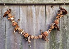 a number of objects hanging on a wooden fence