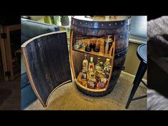 a wooden barrel filled with lots of bottles