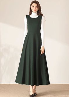 "★★ FEATURES * 30% wool, other fiber, nylon * Polyester lining * Two side pockets * Back zipper closure * Sleeveless * Fitted waist dress * Maxi wool dress * Winter wool dress * Perfect for Winter, autumn * Dry clean * White blouse is not sale items ★★ The model is 170 cm (5′ 7″) tall with a 80 cm (31.5\") bust, 66 cm (26\") waist. She is wearing the wool dress in size XS. ★★ Bespoke Order Service If you Request other color Request the length Request a sleeve Your height is not between 155 cm- 1 Winter Warm Dresses, Sleeveless Dresses With Pockets For Fall, Solid Sleeveless Dress For Fall, Solid Sleeveless Dresses For Fall, Fall Sleeveless Solid Dresses, Elegant Sleeveless A-line Dress With Pockets, Elegant A-line Sleeveless Dress With Pockets, Elegant Sleeveless Winter Dresses, Elegant Spring Wool Dress