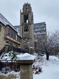 an old church with snow on the ground