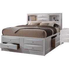 a white bed with drawers underneath it