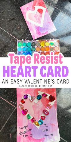 valentine's day craft with tape resist heart card and paper hearts on the ground