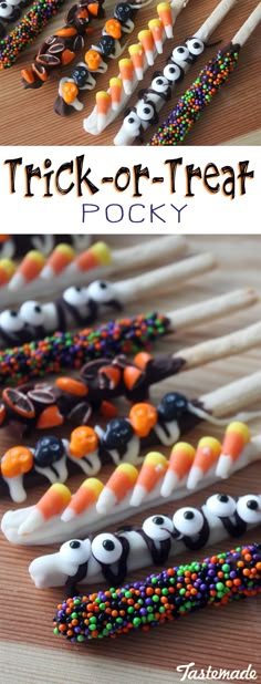 halloween candy sticks are lined up on a table