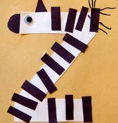 a zebra made out of strips of paper