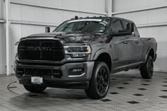 a large gray truck parked in a garage