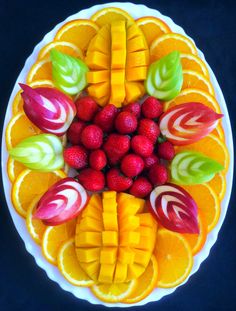 a white plate topped with fruit and veggies