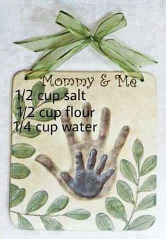 a ceramic plaque with a hand print on it that says mommy & me 12 cups salt 1 / 2 cup flour 4 / 4 cup water