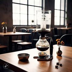 a coffee maker sitting on top of a wooden table