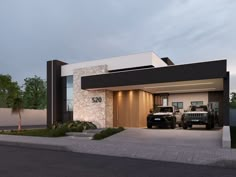 two trucks parked in front of a modern home