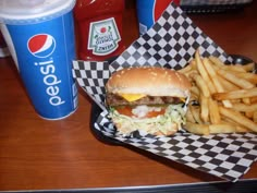 a hamburger and french fries on a table