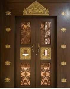 a wooden door with intricate carvings on the side and glass panels in the top half