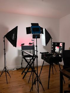 several lights are set up in an empty room