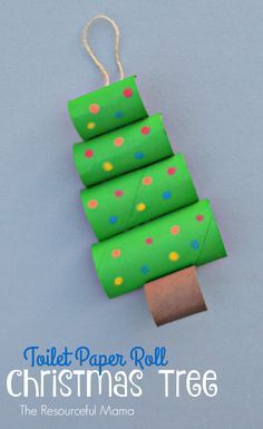 toilet paper roll christmas tree ornament made out of green wrapping paper and colored dots