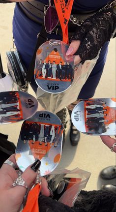 a group of people holding up their skis with the names of skiers on them