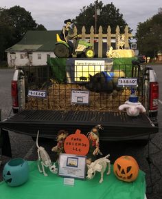 the back of a truck with fake animals in it