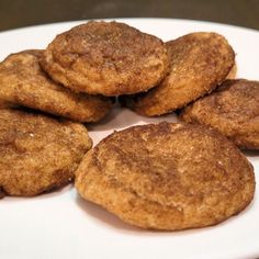 a white plate topped with cookies on top of a table