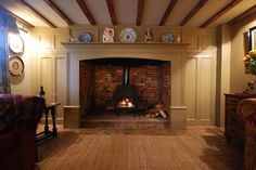 a living room filled with furniture and a fire place