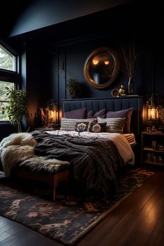 a bedroom with black walls and wooden floors, a large bed covered in fluffy blankets