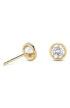 Lab-grown diamonds are bezel set in 14-karat gold in these gorgeous stud earrings that'll effortlessly elevate any ensemble. 1/4" diameter   Total lab-grown-diamond weight: 1.0ct.   Color: G–J   Clarity: VS   14k gold/lab-grown diamond   Imported   >Diamond Guide Bezel Set Diamond Earrings, Diamond Guide, Bezel Set Diamond, Bezel Diamond, 1 Carat, Diamond Studs, Bezel Setting, Lab Grown, Lab Grown Diamonds