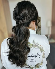 a woman with long hair wearing a white shirt