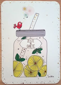 a glass jar with lemons and a bird on top