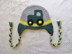 a crocheted hat with a green tractor on it