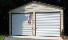 two garages side by side with an american flag on the door and one closed