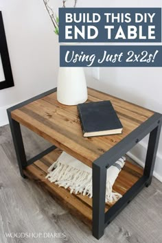 a wooden table with a book and vase on top