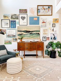 a living room filled with furniture and lots of pictures on the wall above it's coffee table