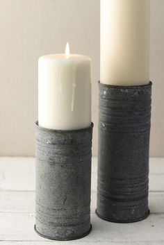 two candles sitting next to each other on a table