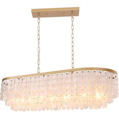 a chandelier hanging from the ceiling with white beads and gold trimmings