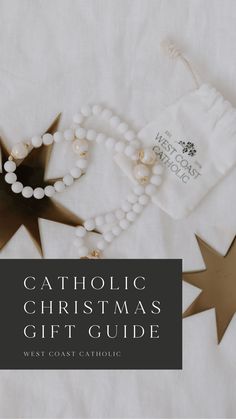 the catholic christmas gift guide is on display with other decorations and accessories around it, including a star ornament