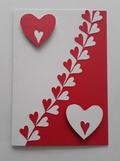 two hearts on a red and white card