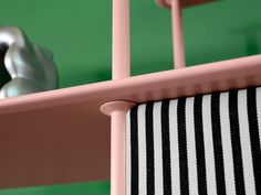 a close up of a chair with a towel hanging from it's back end