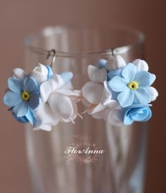 Handmade Forget-Me-Not Earrings Description: Discover the elegance and natural beauty with these charming handmade earrings! Our earrings are crafted from cold porcelain and adorned with delicate forget-me-nots, adding a touch of romantic charm to your look. Key Features: Perfect for: Everyday wear, adding a touch of elegance to any outfit. Special occasions, weddings, and romantic dates. Gifts for loved ones who appreciate unique and stylish jewelry. Advantages of Our Earrings: Uniqueness: Each pair of earrings is handmade, making them one-of-a-kind. Comfort: Lightweight and comfortable to wear, causing no discomfort. Eco-friendly: Made with natural materials and safe paints. Don't miss the opportunity to add this exquisite pair of earrings to your jewelry collection. Order now and experi Blue Polymer Clay, Blue Flower Earrings, Jewelry Bride, Polymer Clay Flowers, Clay Flowers, Romantic Dates, Ribbon Flowers, Cold Porcelain, Bride Jewellery