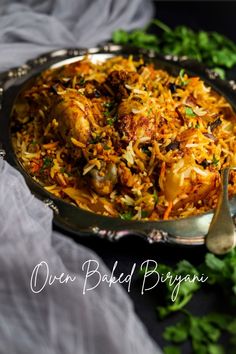 chicken biriyani served in a silver serving dish