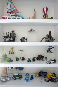 the shelves are filled with toy cars and toys