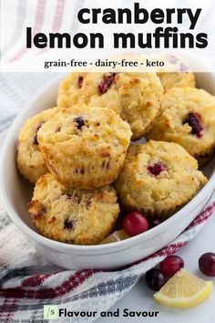 some cranberry muffins are in a white bowl