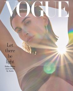 a woman in a bathing suit on the cover of a magazine with sun shining through her hair